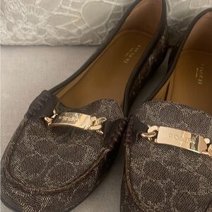 These are woman’s pair of coach shoes loafers never been warm size 11s